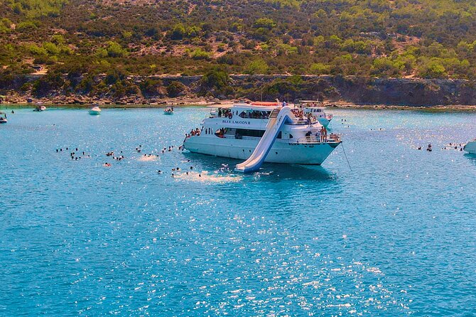 Blue Lagoon (Akamas) Bus & Boat Tour with Water Slide From Paphos - Blue Lagoon: swimming time, snorkeling, and the water slide