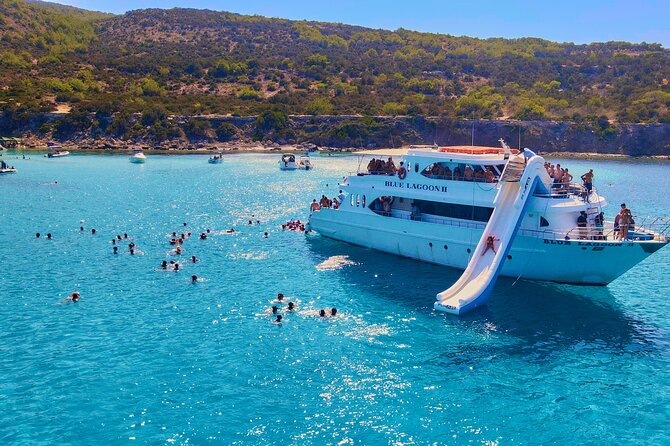 Blue Lagoon (Akamas) Bus & Boat Tour with Water Slide From Paphos - Food, fruit, drinks, and the ride back to Paphos