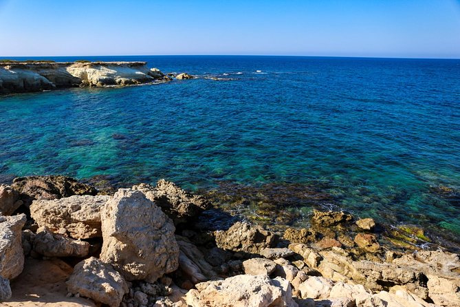 Blue Lagoon and Aphrodite's Baths Guided Day Tour from Paphos - Stop at Edro III shipwreck and sea caves: short time, big atmosphere