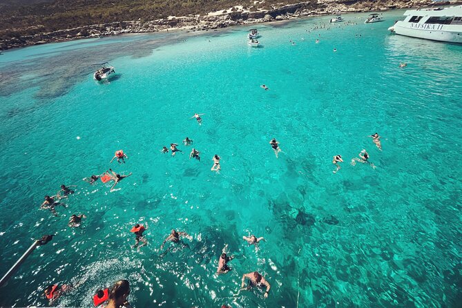 Blue Lagoon trip with slide & music departing from Latchi harbour - Onboard vibe: music, seating, and families with kids