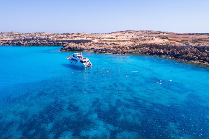 From Paphos: Blue Lagoon Cruise With Water Slide - The Blue Lagoon swim stop: snorkeling, clear water, and the water slide