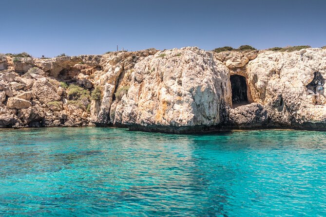 Half-Day Odyssey Guided Boat Safari with Lunch in Cyprus - Stop 2: Cape Pyla Caves, Red Cliffs, and Sea Eagles