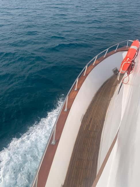 Protaras: 80s and 90s Sunset Cruise with Cypriot Dinner & DJ - Green Bay and Blue Lagoon swimming: the water time you came for