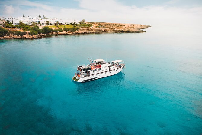 Protaras: St Georgios Presidential Cruise BBQ & 1 drink. 16+ - Blue Lagoon sailing, sea caves, Shark Mouth, and Lovers Bridge