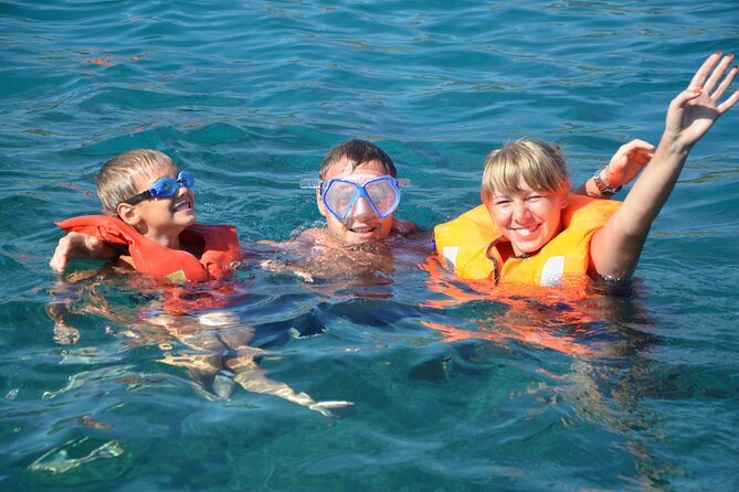 Wave Dancer Sunshine Full Day Cruise - All Inclusive - Onboard comfort: water slide, showers, and sun lounger time